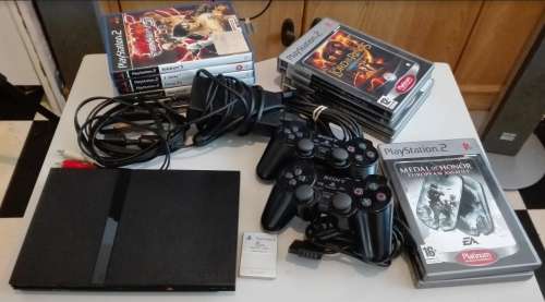 PS2 + 2 Controllers + AV Cable + Power Cable + Memory Card + 12 Games