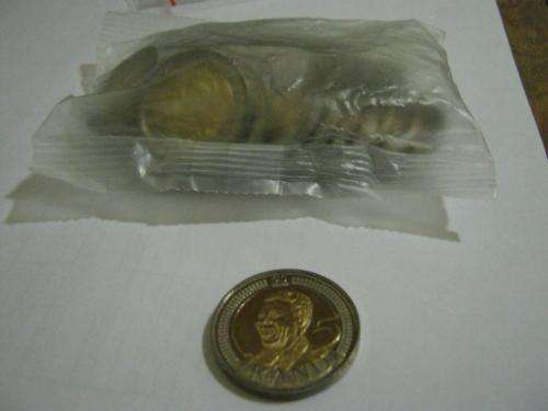 Sealed packet of Nelson Mandela 90th birthday coins