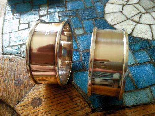 TWO HALLMARKED SILVER NAPKIN RINGS.