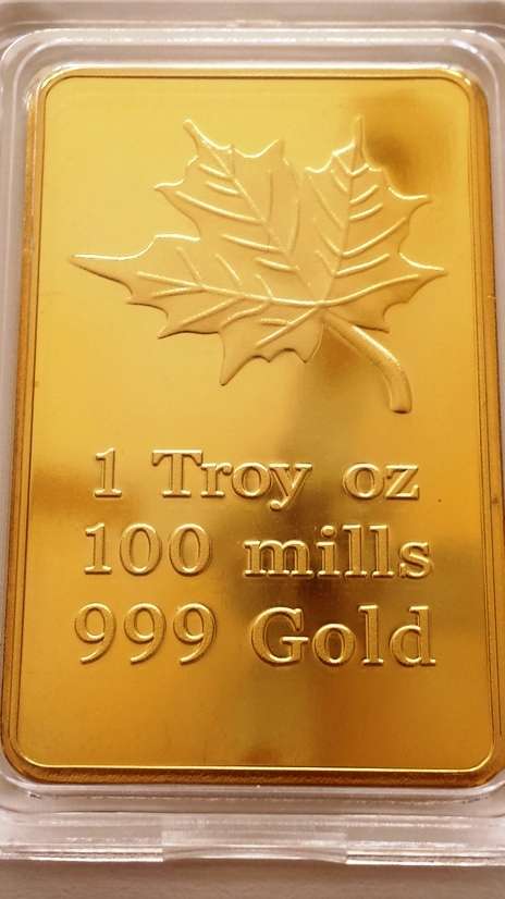 1 TROY OUNCE GOLD CLAD CANADA MAPLE BAR - SEALED IN CAPSULE.
