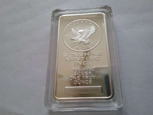 SILVER EAGLE- SUNSHINE MINTING INC. .999 FINE SILVER ONE TROY OUNCE CLAD BAR. ENCAPSULATED.