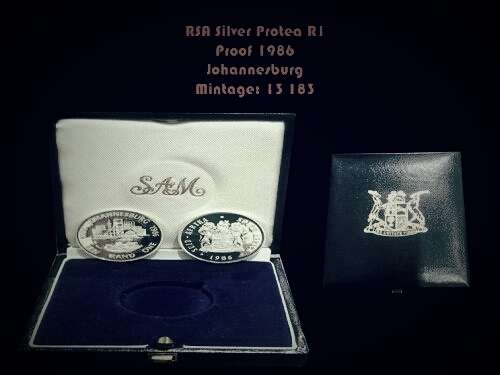 SR1 - PROOF 1986 JOHANNESBURG SILVER PROTEA R1 COIN IN ORIGINAL SA MINT BOX.  MINTAGE ONLY 13183