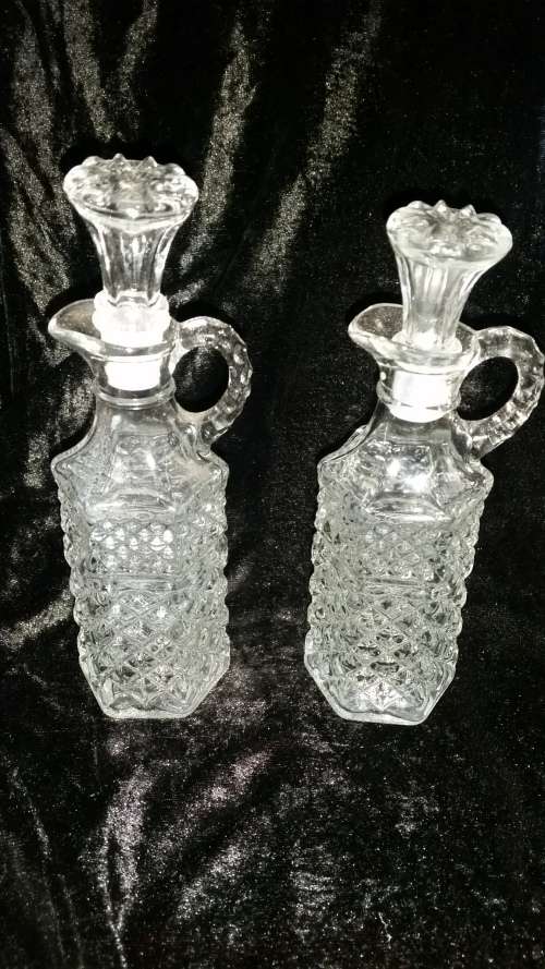 a pair of crystal or glass bottles