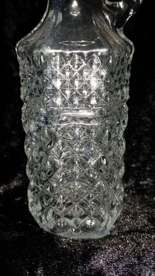a pair of crystal or glass bottles
