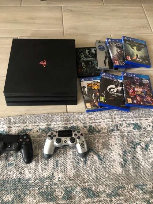 Playstation 4 Pro with 2 controllers and games