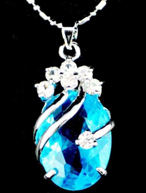 SKY BLUE CRYSTAL NECKLACE. PENDANT AND CHAIN. DONT MISS OUT!!