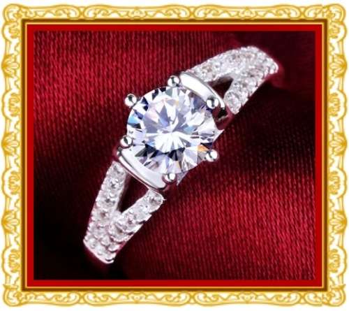 Split band 0.94ct brilliant cut white cubics engagement ring. Size 7 only.