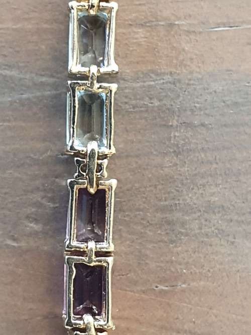 14k tennis bracelet set with various stones and diamond accents