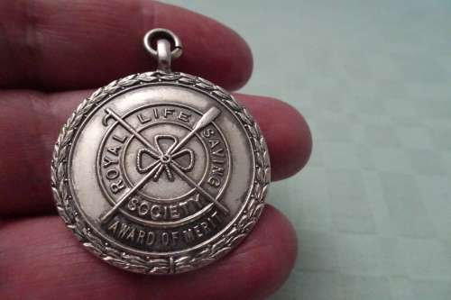Hallmarked Silver Royal Life Saving Society award of Merit Medal in Pendant to C.P. Hewgill -
