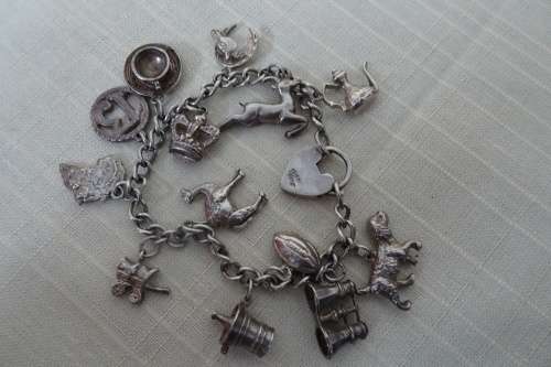 Stunning Silver Bracelet with 13 Lucky Charms (Please see Description) in Good Condition