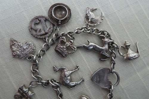 Stunning Silver Bracelet with 13 Lucky Charms (Please see Description) in Good Condition