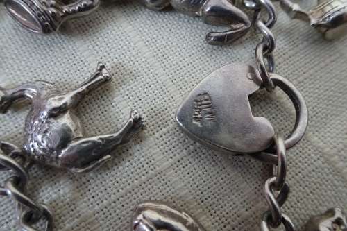 Stunning Silver Bracelet with 13 Lucky Charms (Please see Description) in Good Condition