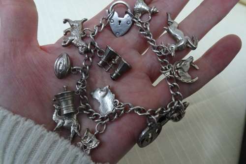Stunning Silver Bracelet with 13 Lucky Charms (Please see Description) in Good Condition