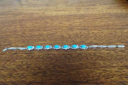 Superb Sterling Silver Linked Chain Bracelet With Turquoise Stones and Ornate Surround 9.3 g
