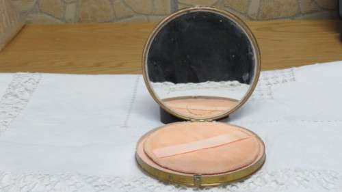 Pretty Vintage Gold Metal and Cream Dancing Lady With Basket Round Powder Compact D: 10 cm