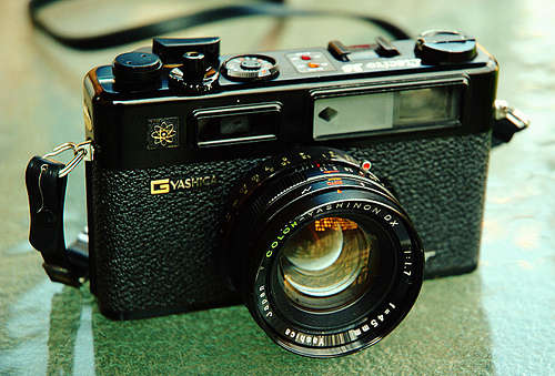 Vintage Yashica Electro 35 rangefinder camera with two extra lenses