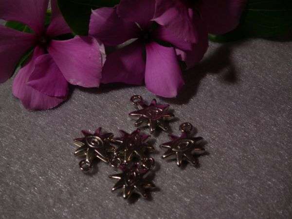 Eye of the Sun charms (10 in packet)