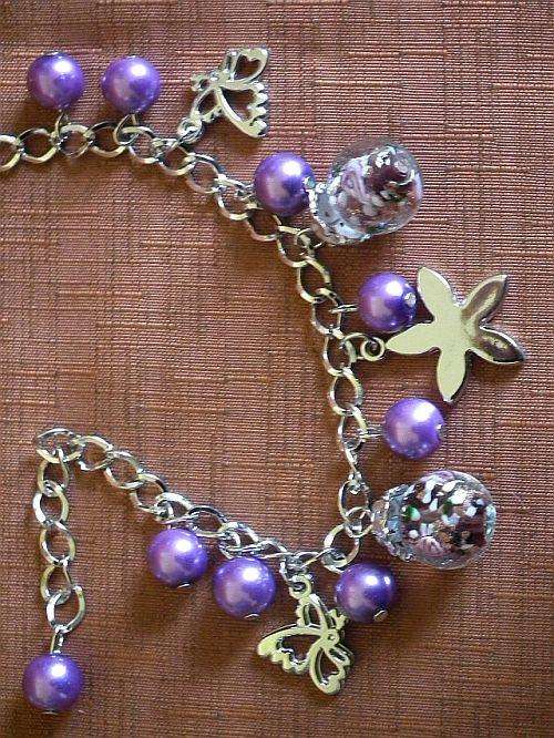Bracelet with purple glass beads and charms