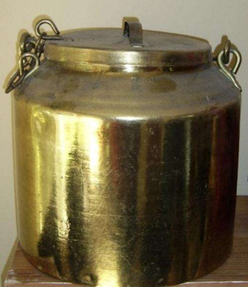 A very handsome antique milk can