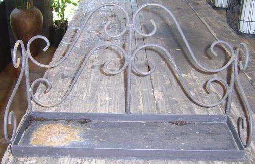 AN OLD RUSTY METAL SHELVE