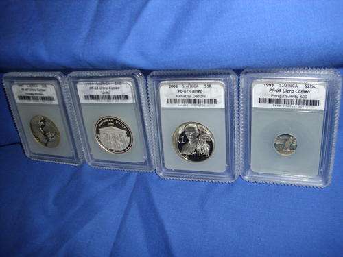 Four graded coins.