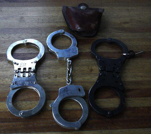 Handcuffs and one Leather poach.