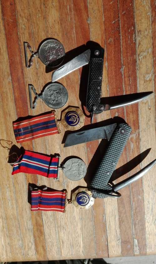 TWO KNIVES AND MEDALS.