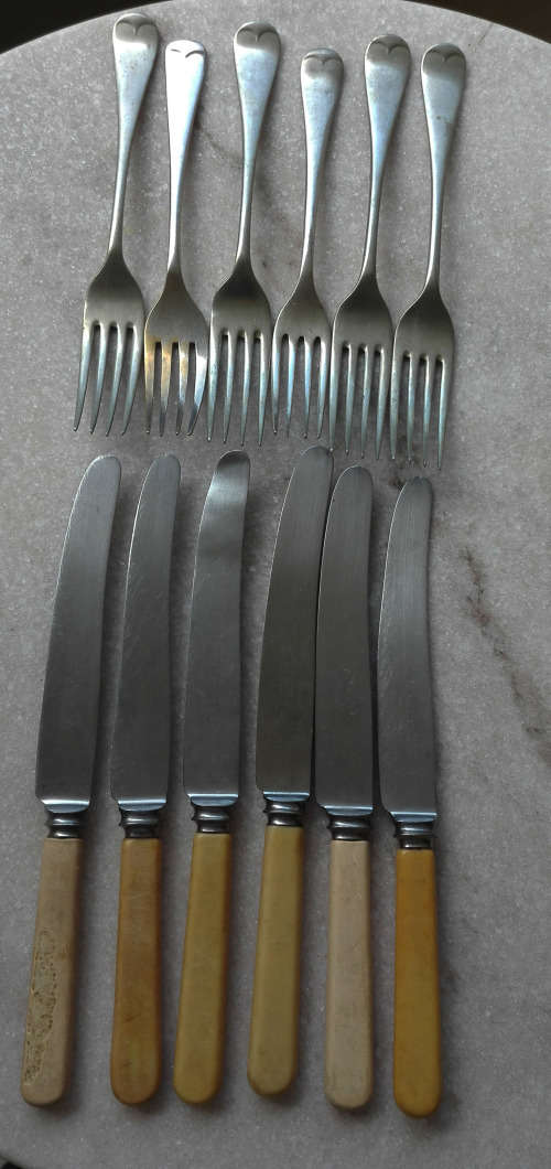SET OF VINTAGE BONE HANDLED KNIVES AND FORKS.