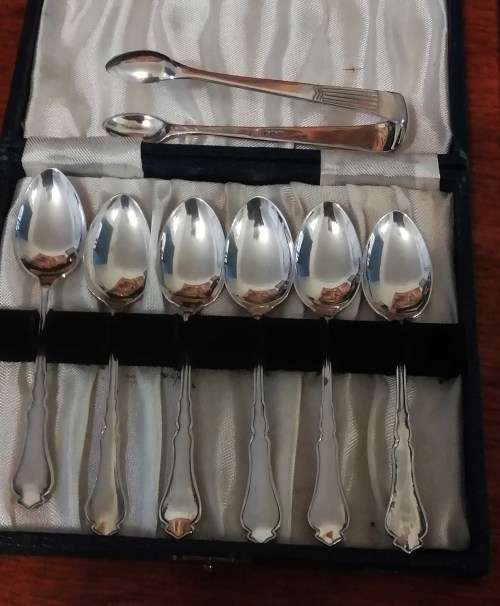 SIX .925 SILVER TEA SPOONS AND SUGAR TONG.