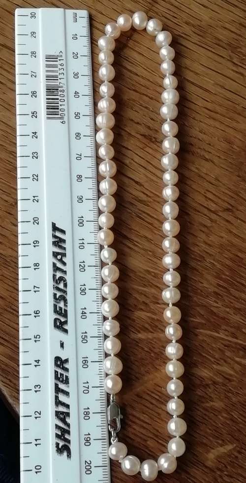 STRING OF PEARLS NECKLACE.