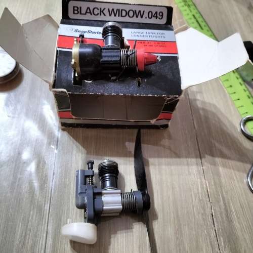 COX .049 MODEL AIRCRAFT ENGINE, BLACK WIDOW. AND ONE OTHER ENGINE.
