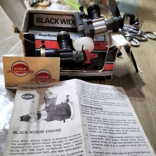 COX .049 MODEL AIRCRAFT ENGINE, BLACK WIDOW. AND ONE OTHER ENGINE.