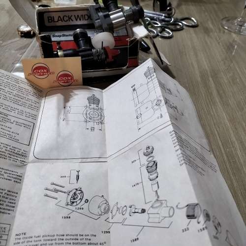 COX .049 MODEL AIRCRAFT ENGINE, BLACK WIDOW. AND ONE OTHER ENGINE.