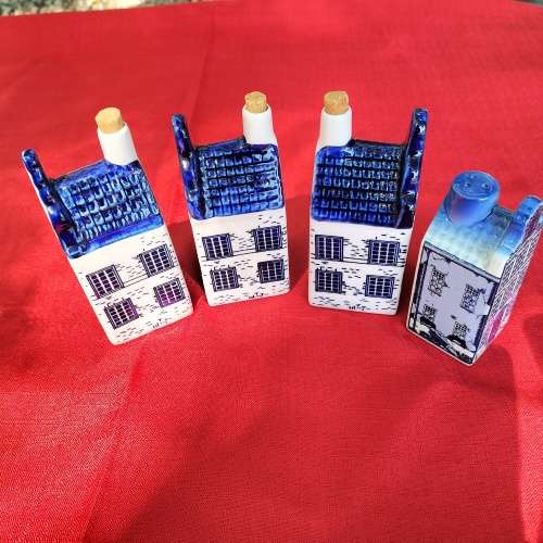 FOUR DELFT HOUSES.