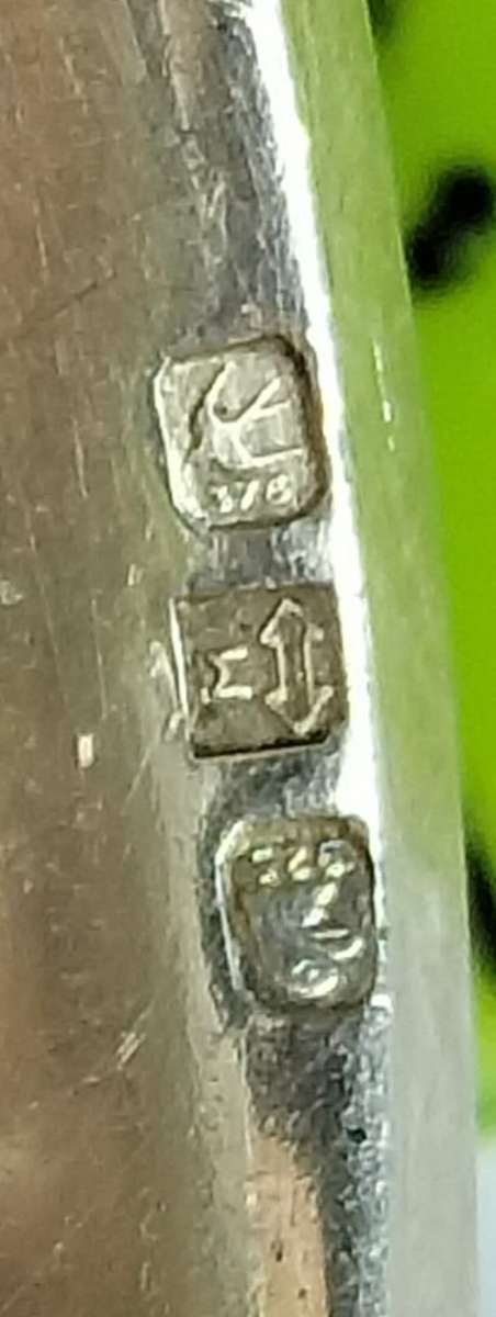 MEN`S SILVER AND 9ct GOLD RING.