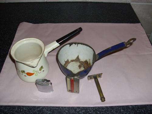 Two enamel containers and two lighters and one rasor