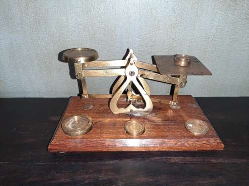 Antique brass and wood postal weight scale