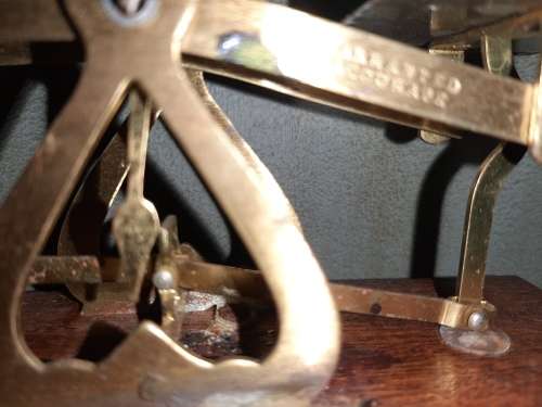 Antique brass and wood postal weight scale