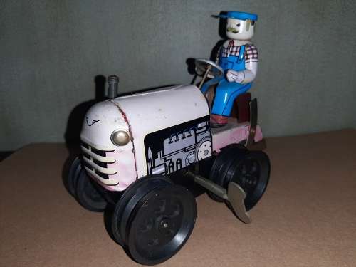 Vintage wind-up tin tractor