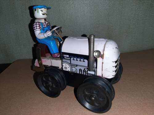 Vintage wind-up tin tractor