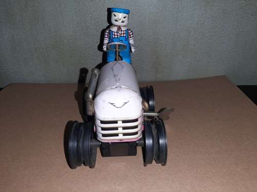 Vintage wind-up tin tractor