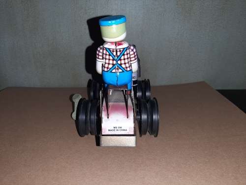 Vintage wind-up tin tractor