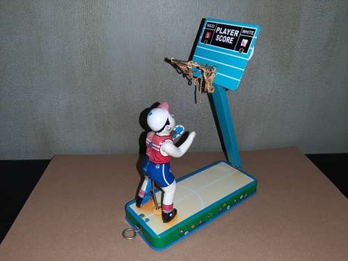 Vintage tin toy basketball player