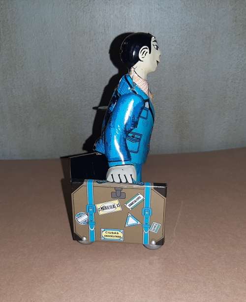 Classic tin toy wind-up Spanish man with two suitcases