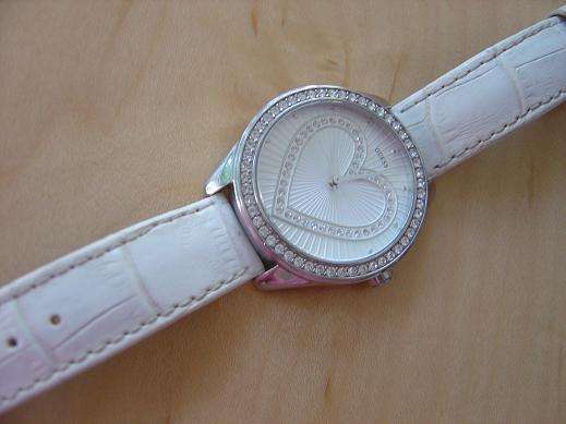 Guess watch, essentially brand new, white leather strap, heart shaped face, surrounded with Diamante