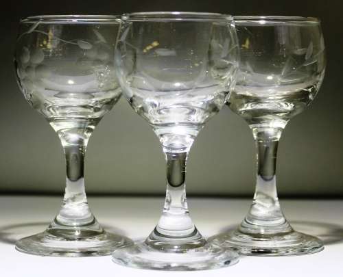 three small cherry glasses