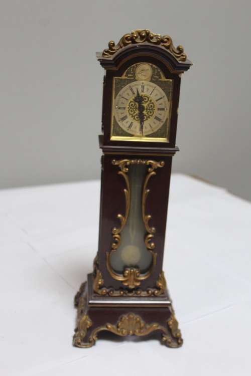 Mini windup Grand Father Clock - slight nicks on the top