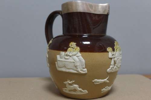 Royal Doulton big jub with a sterling silver trim