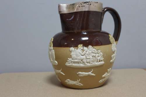 Royal Doulton big jub with a sterling silver trim