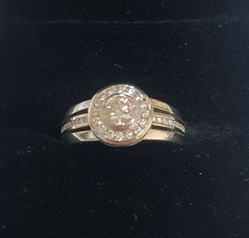 18ct White gold diamond halo ring c/w channel set diamonds on the sides